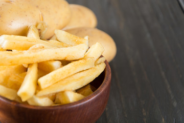 french fries on wood background