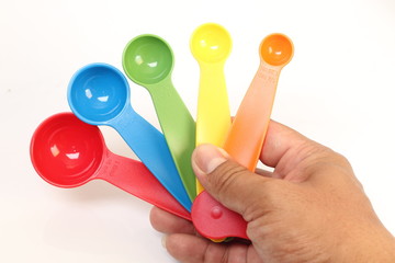 colorful measuring spoons isolated on white