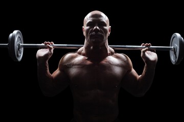 Portrait of bald man lifting crossfit