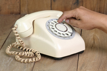 Retro rotary telephone on wood table