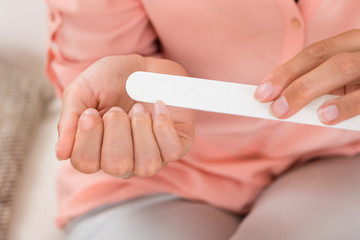 Person Hands Filing Nails