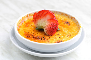 Vanilla bean creme brulee with strawberry
