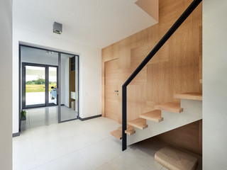 staircase hall with wood paneling