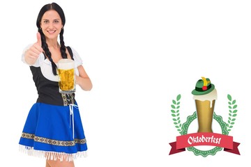 Obraz premium Composite image of pretty oktoberfest girl holding beer tankard