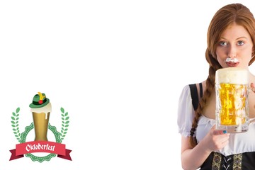 Composite image of oktoberfest girl drinking jug of beer