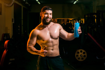 Fototapeta na wymiar man in the gym with shaker