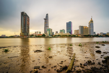 Cityscape of Ho Chi Minh city at sunset, viewed over Saigon river. Ho Chi Minh city (aka Saigon) is the largest city and economic center in Vietnam with population around 10 million people.