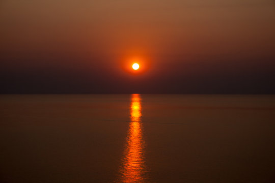 Fototapeta Red sunrise over Lake Malawi.