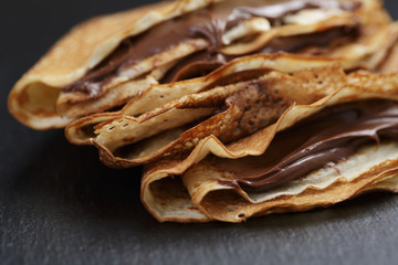 thin crepes or blinis with chocolate cream