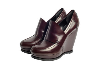 Brown luxury female leather heeled shoes isolated on white backg