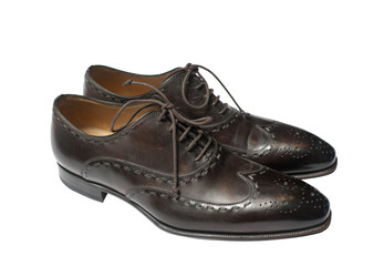 Pair of brown male shoes with laces isolated on white background