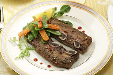 fried ribs with herbs and vegetables