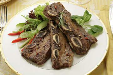 fried ribs with herbs and vegetables