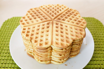 Stack of homemade waffles in form of heart