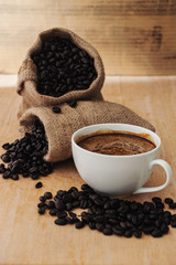 Espresso in a cup of coffee with roasted coffee, Still life tone