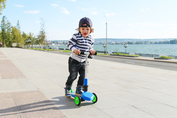 Little boy with scooter © ivolodina