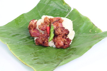 Pork fried rice on banana leaf drop
