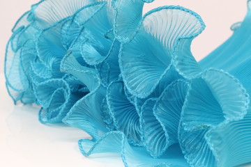 Pressing on a blue chiffon white background.