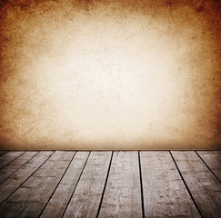 Grunge wall and wood paneled floor, interior of a room.