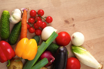 Pile of organic vegetables on a wooden table