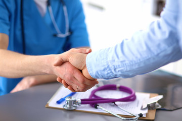 close up of patient and doctor taking notes