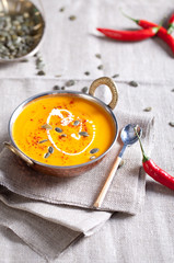 Pumpkin cream-soup with chili and seeds