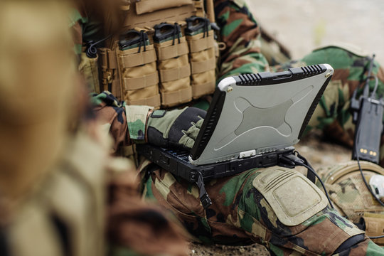 ranger using laptop outdoors