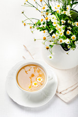 Camomile hebal tea in a white cup with