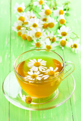 Herbal tea with chamomile flowers