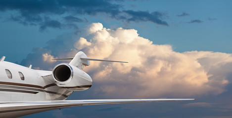 Side view of a private jet in flight