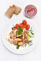 Chicken fillet and vegetable on white plate