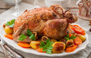 Christmas Stuffed Chicken Served with Potatoes, Carrots and Figs