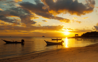 boat on the waves at sunset, beautiful seascape