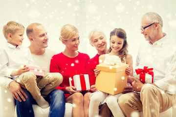 smiling family with gifts at home