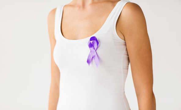 close up of woman with purple awareness ribbon