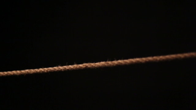 Detail of bondage rope on black background