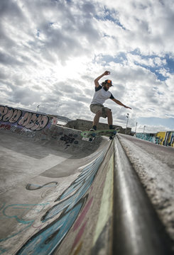 Young man skateboarding in a skatepark