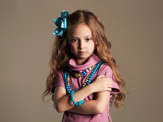 beautiful little girl with healthy hair.pretty little lady in dress