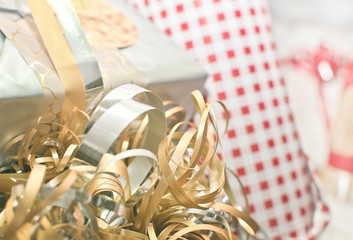 Christmas wrapping paper in gold, silver, red and white colors for background or copy space.