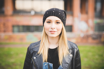Portrait of young beautiful blonde straight hair woman in the ci