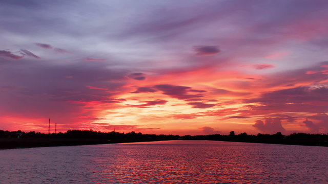 Timelapse sunrise sunset reflection on river