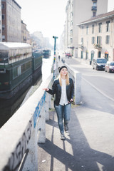 young beautiful blonde straight hair woman walking in the city,