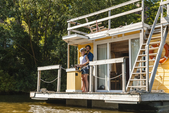 Couple having a trip on a house boat