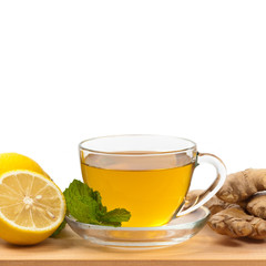 Ginger tea. Ginger, lemon, mint leaves on white background. Selective focus.