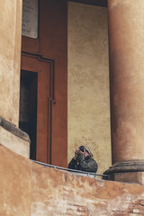 Man taking pictures of architecture at San Luca in Bologna, Ital