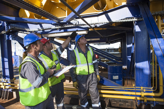 Crew onboard a ship inspecting with clipboard