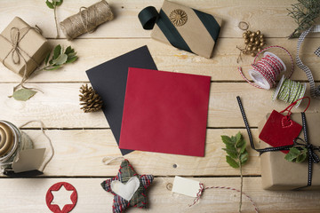 empty greeting cards and Christmas ornaments on wooden backgroun