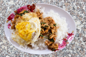 Stir-fried minced pork with holy basil and steamed rice (Thai food).
