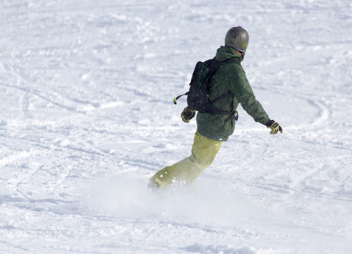 man snowboarding in the snow