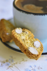 Cantuccini and coffee in a blue cup.Tinted photo.